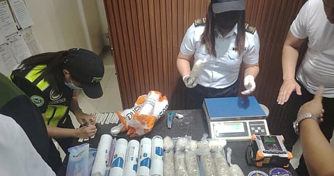 AUTHORITIES from the Ninoy Aquino International Airport Inter-Agency Drug Interdiction Task Group inspect 14 abandoned inbound parcels containing suspected illegal drugs intercepted at the Central Mail Exchange Center in Pasay City. The joint operation was conducted by the Philippine National Police, Bureau of Customs and Philippine Drug Enforcement Agency.