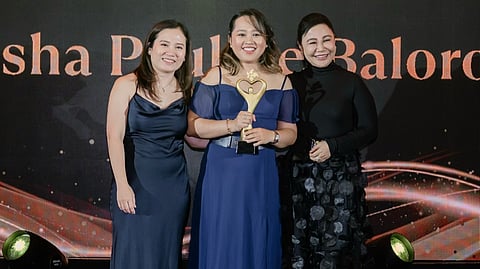 NUTRIASIA's 2026 Husay Awards Marketer of the Year Trisha Pauline Baloro (center) stands victorious with NutriAsia General Manager Ampy Rio (right) and Gretchen King (lef), Group Head for Consumer and Category Marketing during the annual awards night held on 27 May 2026 at the Sheraton Hotel in Pasay City.