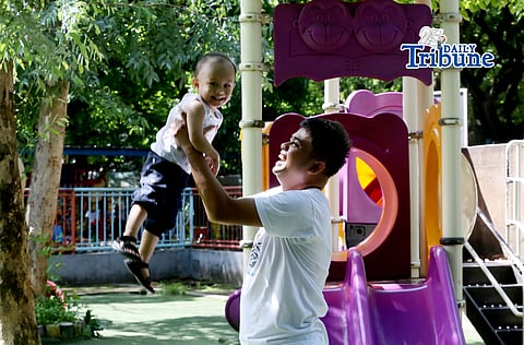 (June 20 2026) A father cared for his son while playing as they spent their time at Quezon City Circle on Saturday June 20 2026. A head of Fathers Day Celebration. Photo/Analy Labor