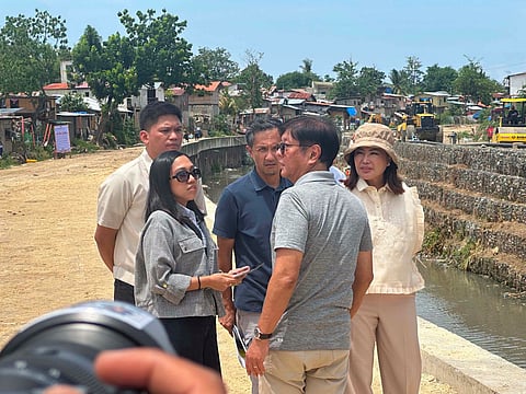 President Ferdinand Marcos Jr. and DPWH Secretary Vince Dizon, with Cebu Governor Gwen Baricuatro, inspect the ongoing rehab of Managa River in Barangay San Isidro, Talisay City, Cebu on Monday.