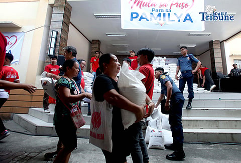 (June 22 2026) Residents at  Barangay Dona Imelda in Quezon City on Monday June 22 2026, queued to receive a 10 kilos of rice during the First Lady rice distribution drive launching. First Lady Louise Araneta Marcos spearheaded a rice distribution drive through community visits within Metro Manila, it is inspired by simple belief that every Family deserves food on the table is an initiative to provide immediate assistance to families across metropolis. Photo/Analy Labor