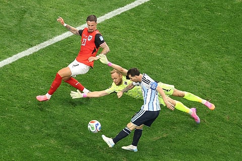 Lionel Messi #10 of Argentina shoots while Marco Friedl #23 of Austria blocks during the FIFA World Cup 2026 Group J match between Argentina and Austria at Dallas Stadium on June 22, 2026 in Arlington, Texas. 