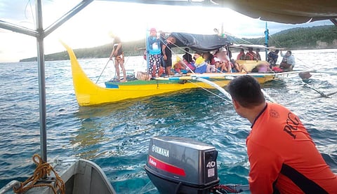 A RESCUE team from the Coast Guard District Southern Mindanao escorts passengers and crew from the distressed motorized vessel MBCA Lerrie Jie to safety off Barangay Gumasa in Glan, Sarangani Province. All passengers and crew members were safely returned to shore in good physical condition.