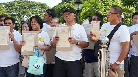 SIXTY families displaced by the 1991 Mt. Pinatubo eruption finally received their official land titles during a distribution ceremony at the EPZA Resettlement Center in Barangay Pulung Cacutud, Angeles City.