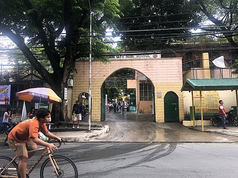 A teenager rides a bicycle along Scout de Guia Street in front of Quezon City High School in Diliman, Quezon City, on June 1. The Quezon City government, however, has ordered city police and barangays to assess school security and identify possible access points following a recent school shooting incident in Tacloban City. (PHOTOGRAPHED by Sean Magbanua for the Daily Tribune).