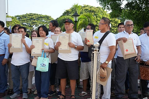 60 families displaced by Mt. Pinatubo receive land titles after 35 years