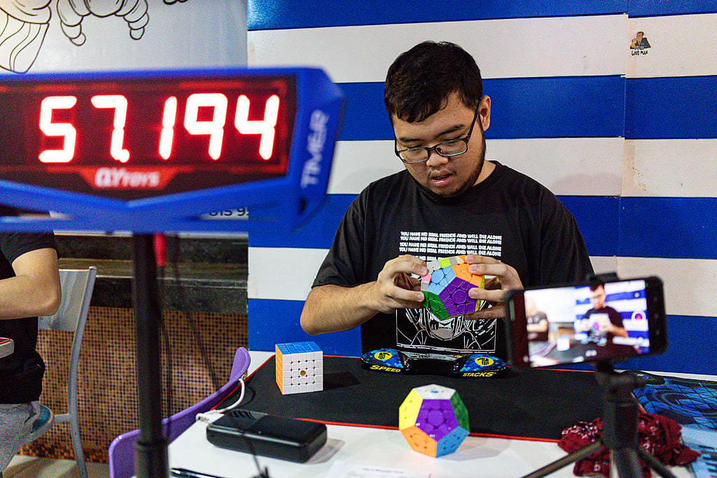 Speedcubers attempt to break records at a Rubik's competition