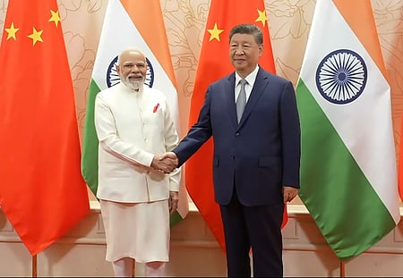 Prime Minister Narendra Modi and Chinese President Xi Jinping in Tianjin during the SCO Summit, discussing strengthened bilateral ties and regional stability.