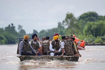 Punjab CM Bhagwant Mann reviews flood-hit areas of Ferozepur in a boat, urging the Centre to enhance compensation for affected farmers and families.