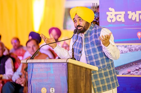 CM Mann at Jalalabad rally launching road projects.