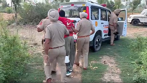 Police officials with the accused