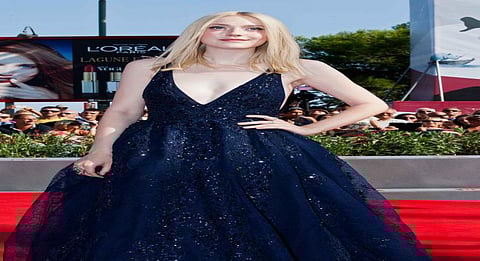 Dakota Fanning wears a necklace with her dead dog's hair