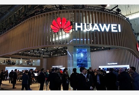 Chinese tech giant Huawei raided over tax evasion, firms says cooperating (Ld)