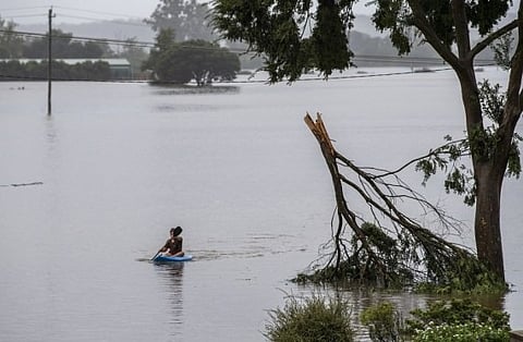 Australian rescue workers, communities come together to fight catastrophic floods