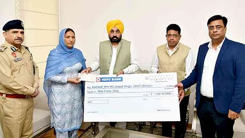 CM hands over cheque of insurance worth Rs 1 crore to family of martyred Home Guard Jawan Jaspal Singh 