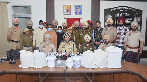 Punjab police busts narco smuggling and arms cartel; two held with 8.2kg heroin, glock among four pistols