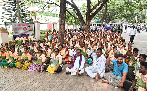 Civic workers staged a protest in Hubballi, wearing black badges, to demand the fulfillment of various demands.