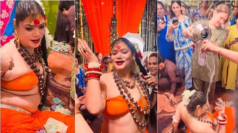 Dance by a woman in saffron robes