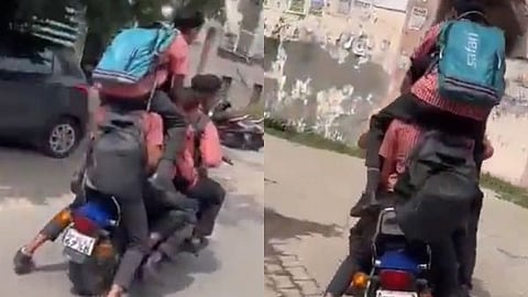 Six students heading to school, packed onto a single motorcycle.