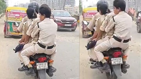 A scene in Bihar showing four police personnel riding a single motorcycle without wearing helmets.