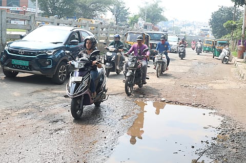 Roads in RR Nagar turn into ponds during the monsoon due to potholes.