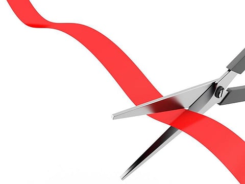 scissors cut the red ribbon