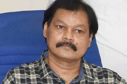 Dr. PALAKSHA