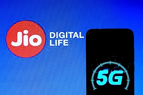 In this photo illustration a 5g mobile Spectrum logo