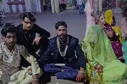 Bride and groom protest at police station