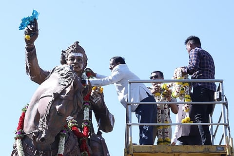 Garlanding of Basaveshwara idol by DC