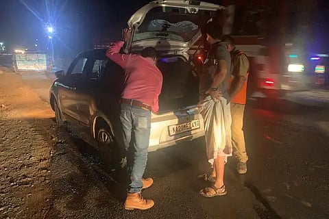 Police checking vehicales in torch light in hiregutti checkpost