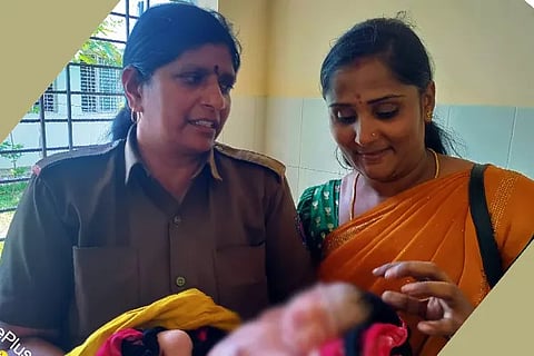 Bus conductor with woman
