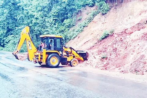 Land sliding in Arabail Ghat. removed with JCB