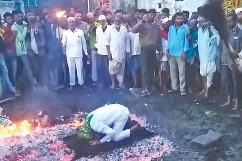 Praying on a blanket in the fire pit