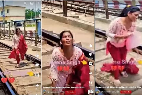 Woman dances on railway track