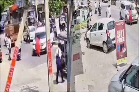 woman on cars bonnet