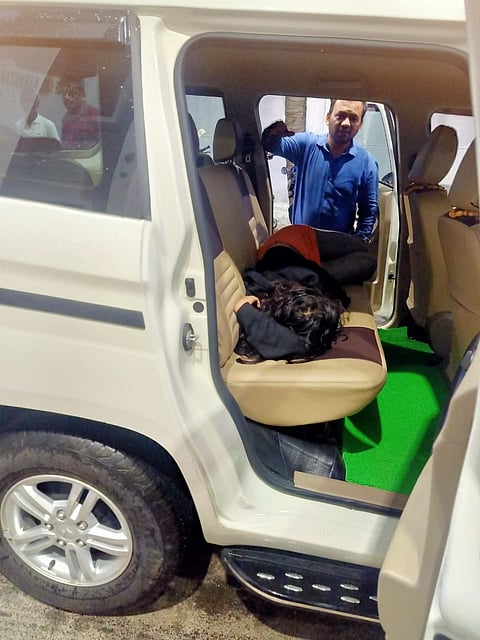 officer carry girl at Jeep