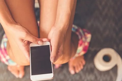 using phone in toilet