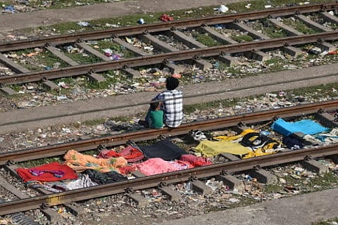 Viral Video Shows People Cooking Drying Clothes On Railway Tracks Near Mahim Station RPF Takes Prompt Action