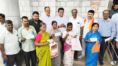 MLA Ravikumar distributed the check Mandya