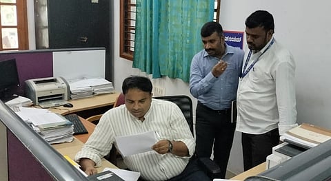 mysore dc checked the file in the Mysore Tehsildar office