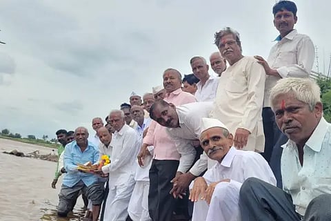 An offering of water to the river Krishna