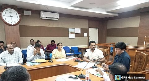 adc koppal democracy day man chain linking meeting