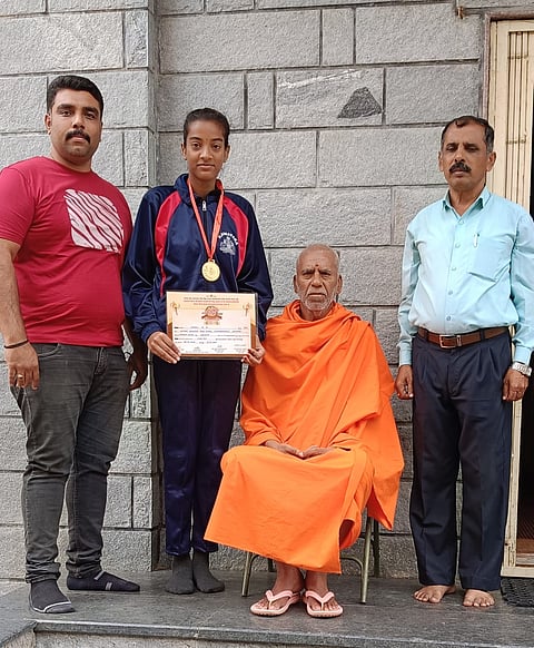 Achievement in the state level shot put competition Mandya