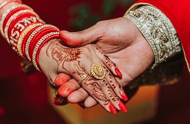 newlywed-couple-holding-hands-together-260nw-2331622613