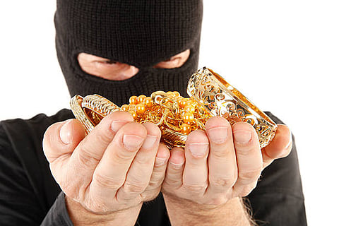 This is masked man robber with stolen gold.