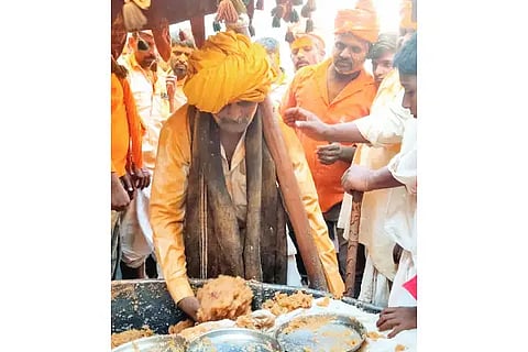 Devotees who put their hands in the hot water