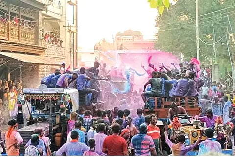 Youths bathed in color