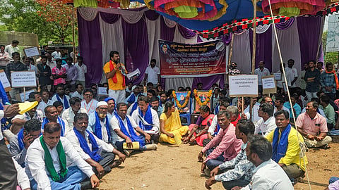 district koppal building labour protest dc office