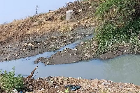 Dirty water flowing into the creek